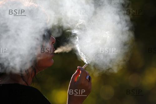 Woman smocking a cigarette