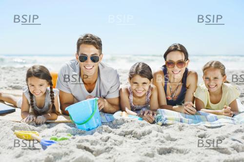 Portrait of smiling family on beach